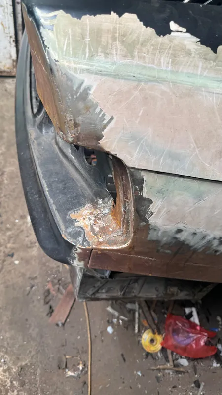 E36 rear corner with the quarter cut open, rust and filler