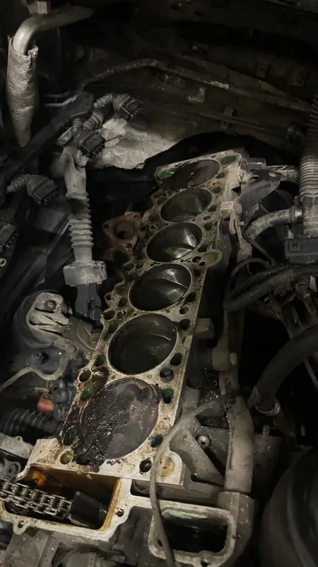 Six-cylinder block deck with the head removed, cylinder bores visible