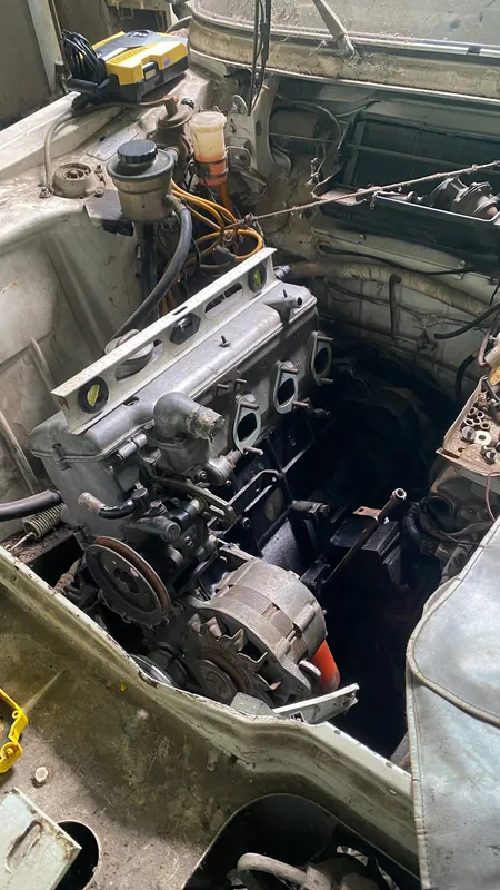 Engine bay of the old BMW saloon with a four-cylinder fitted