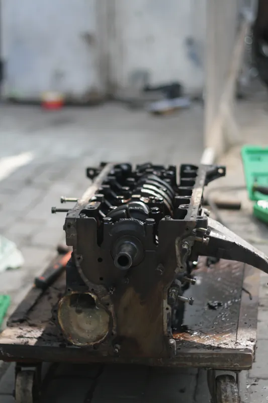 BMW engine block, stripped, on a trolley