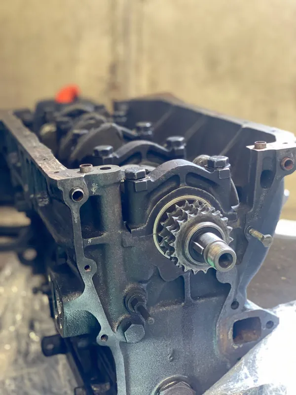 Bare engine block with the timing sprocket on the crankshaft nose