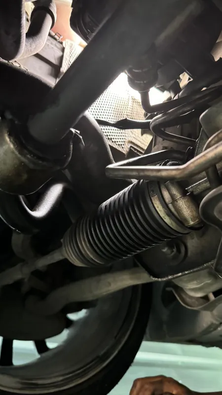 Steering rack gaiter and sway bar from underneath on a Mercedes C-class